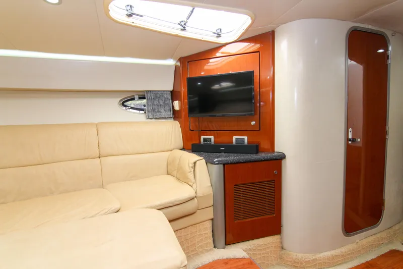 Slide: The Image of Interior of 2008 Formula 400 Super Sport yacht with beige seating and modern amenities. - 25