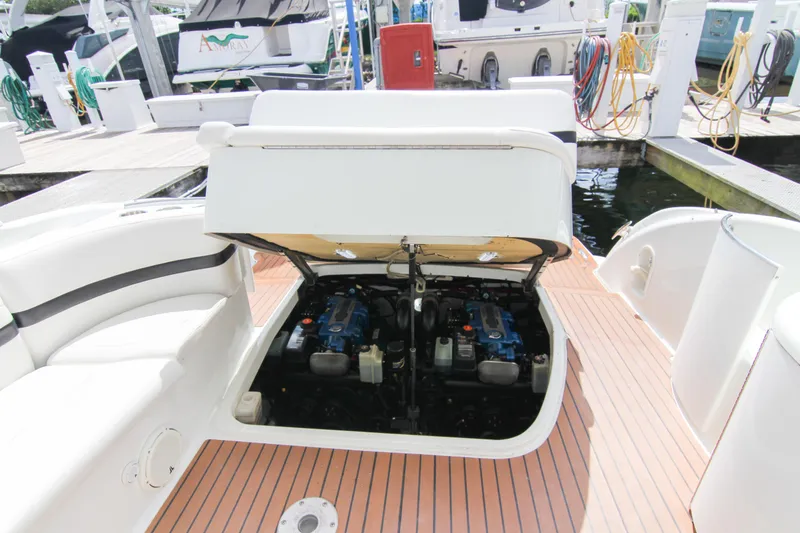 Slide: The Image of 2008 Formula 400 Super Sport boat engine compartment at marina dock. - 28