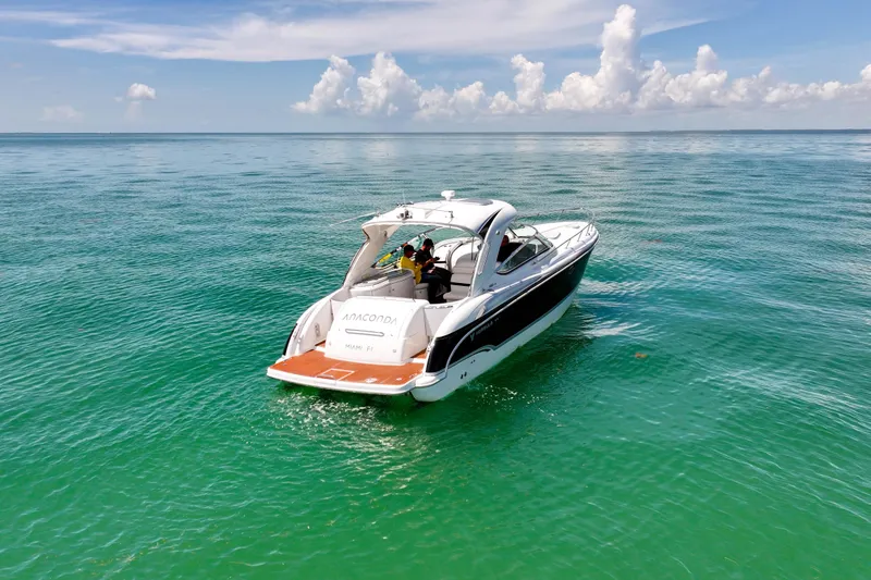 Slide: The Image of 2008 Formula 400 Super Sport boat cruising on clear turquoise waters under a blue sky. - 3