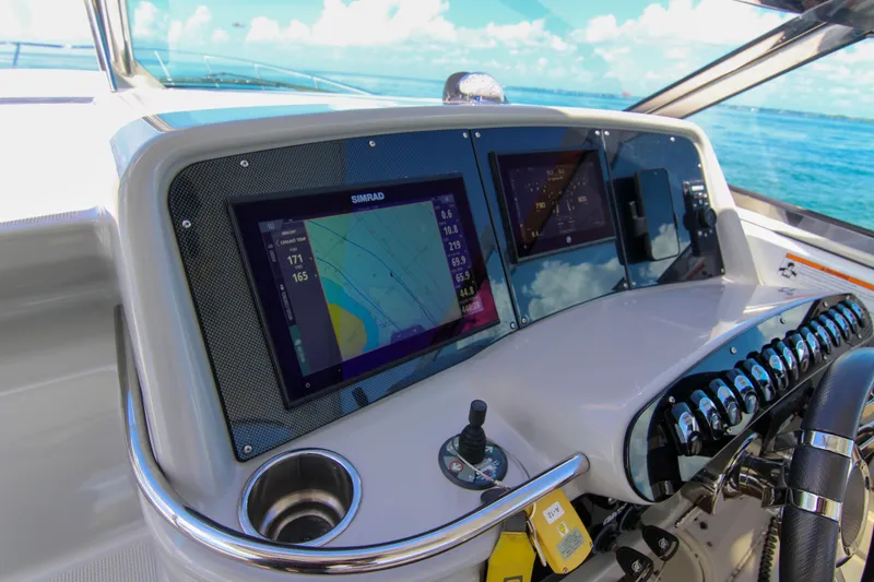 Slide: The Image of Dashboard of a 2008 Formula 400 Super Sport boat with navigation screens and controls. - 33