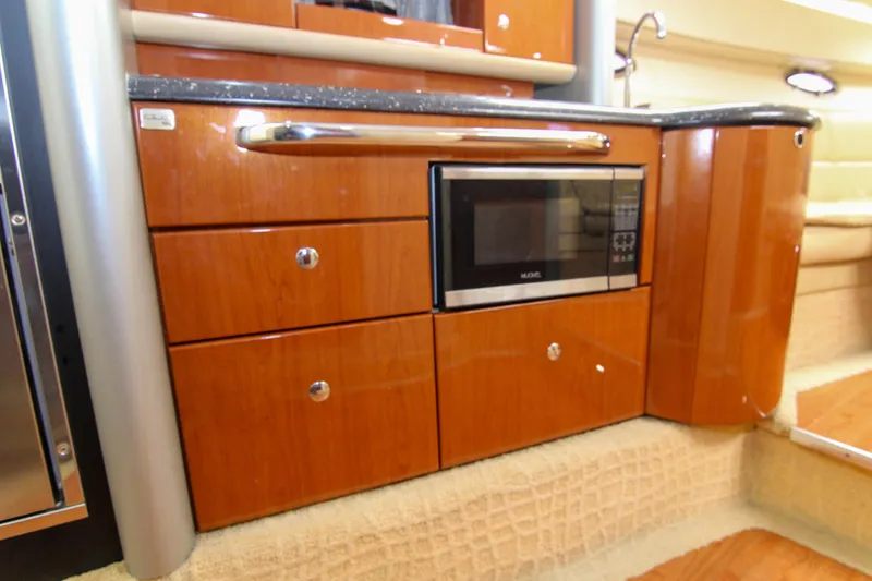 Slide: The Image of 2008 Formula 400 Super Sport yacht interior with wood cabinetry and built-in microwave. - 35