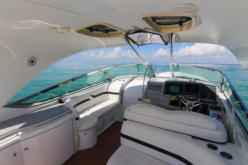 Slide: The Image of 2008 Formula 400 Super Sport yacht interior with ocean view, featuring sleek design and modern controls. - 8