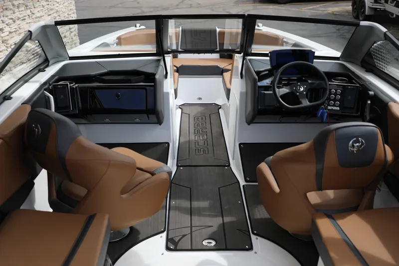 Slide: The Image of 2024 Scarab 235 Wake ID boat interior with modern dashboard and luxurious seating. - 1