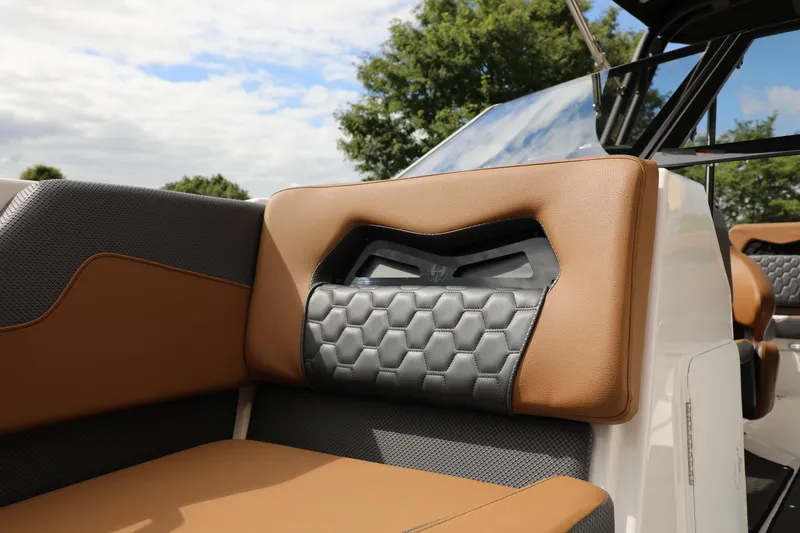 Slide: The Image of 2024 Scarab 235 Wake ID boat interior with stylish brown and gray seating design. - 6