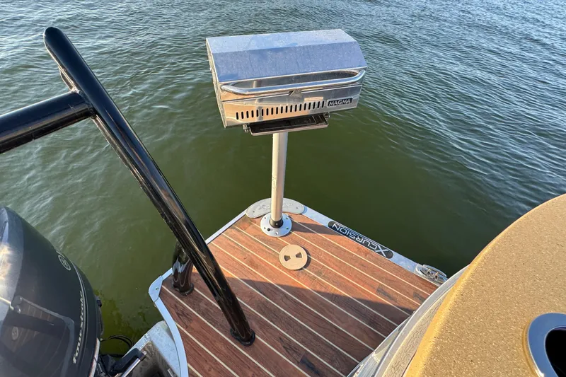 Slide: The Image of Pontoon boat Xcursion 23RFE 2016 with grill on deck, floating on water. - 18