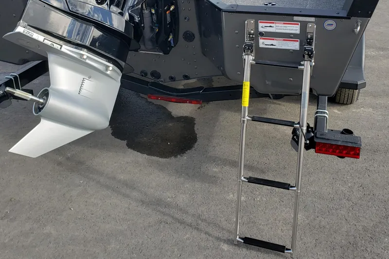 Slide: The Image of 2026 Alumacraft Competitor 175X Sport boat with motor and ladder detail. - 12