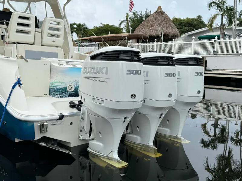 Slide: The Image of 2010 Hydra-Sports 3500 VX boat with triple Suzuki 300 outboard engines docked. - 10