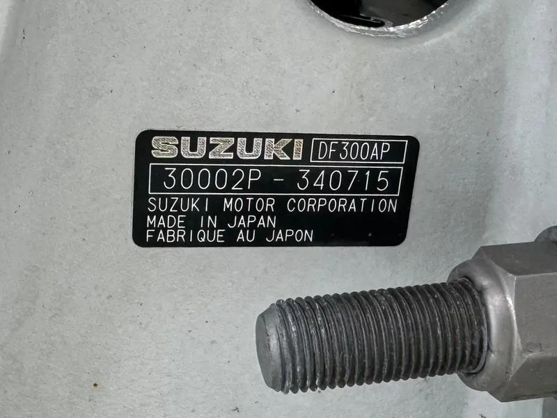 Slide: The Image of Suzuki DF300AP engine label on 2010 Hydra-Sports 3500 VX, made in Japan. - 13
