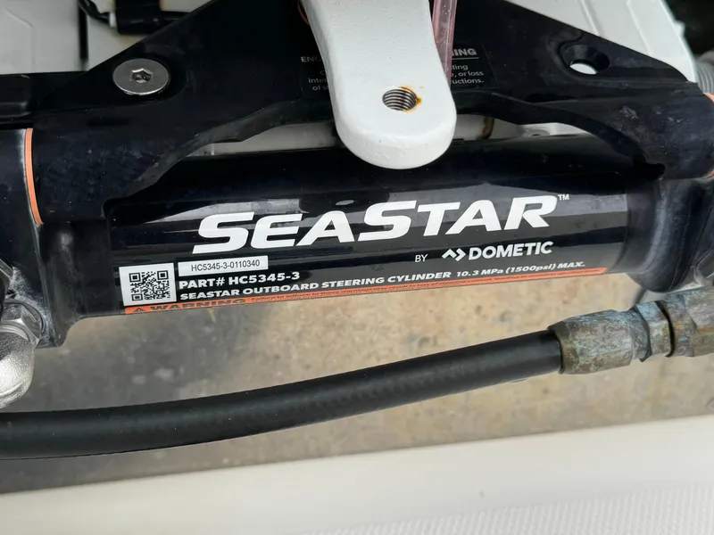 Slide: The Image of SeaStar outboard steering cylinder by Dometic on 2010 Hydra-Sports 3500 VX boat. - 14