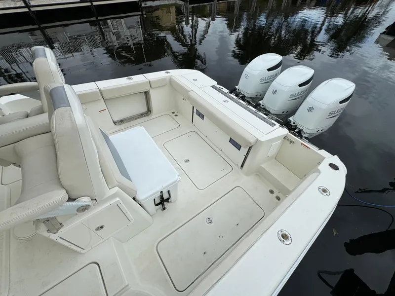 Slide: The Image of 2010 Hydra-Sports 3500 VX boat with triple outboard engines, spacious deck, and seating area. - 15