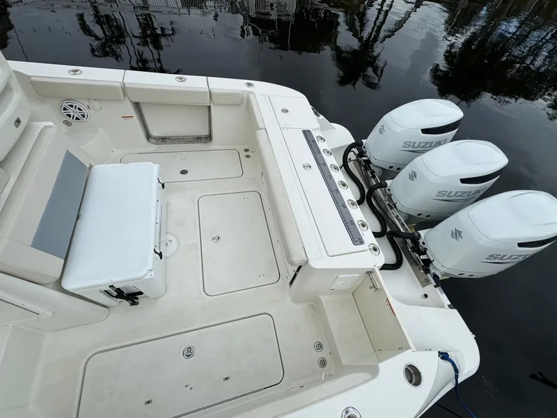 Slide: The Image of 2010 Hydra-Sports 3500 VX boat with triple Suzuki outboard engines, spacious deck view. - 16