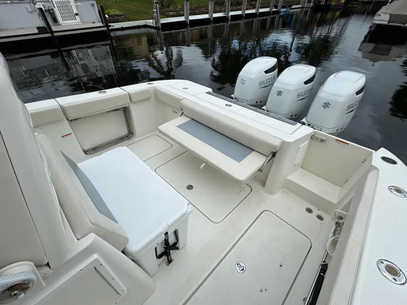 Slide: The Image of 2010 Hydra-Sports 3500 VX boat interior with seating and Suzuki outboard engines. - 21