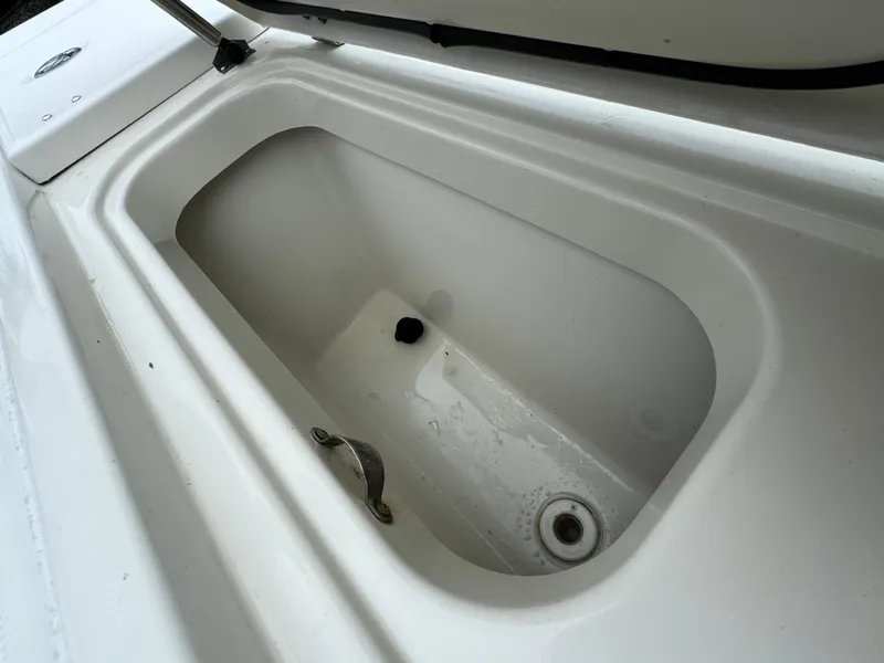 Slide: The Image of Open storage compartment on a 2010 Hydra-Sports 3500 VX boat. - 25