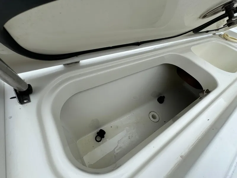 Slide: The Image of Open storage compartment on a 2010 Hydra-Sports 3500 VX boat. - 26