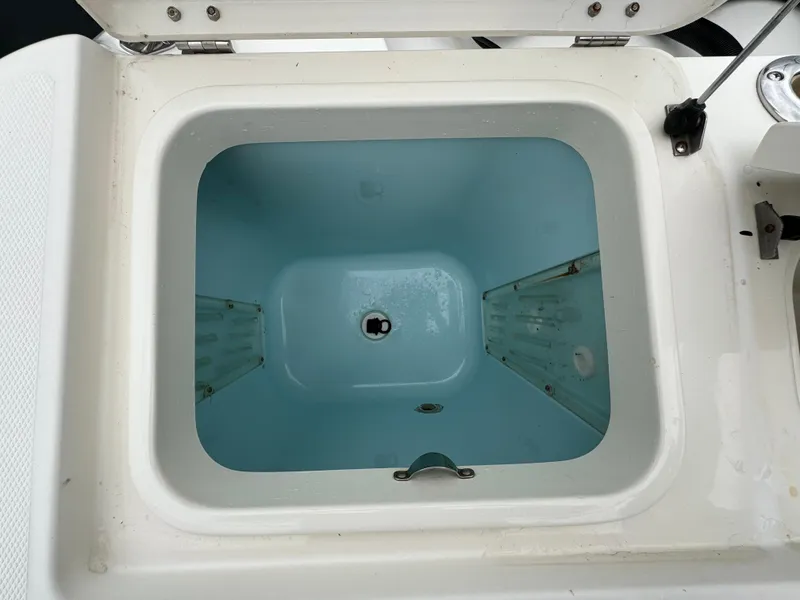 Slide: The Image of Open storage compartment on 2010 Hydra-Sports 3500 VX boat. - 27