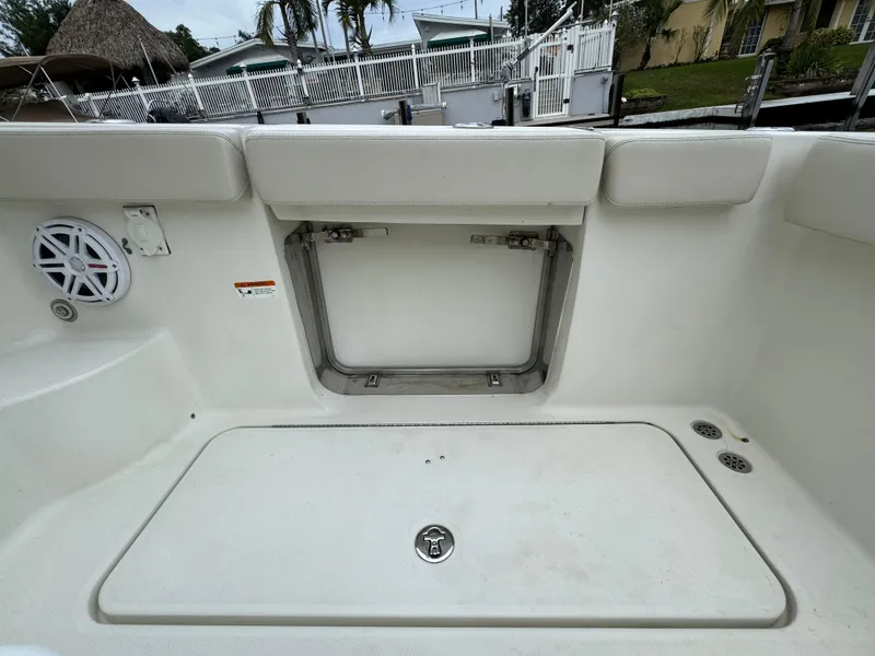 Slide: The Image of 2010 Hydra-Sports 3500 VX boat interior, featuring storage compartment and speaker. - 29