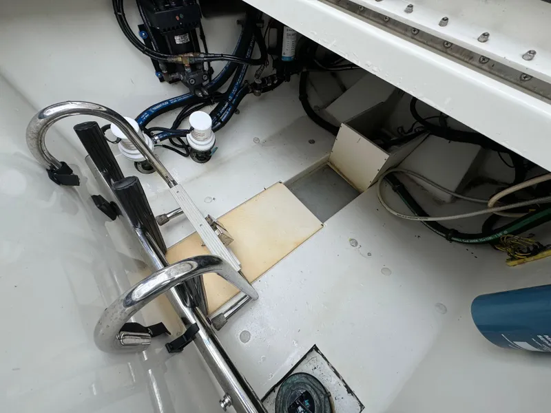 Slide: The Image of 2010 Hydra-Sports 3500 VX boat interior, showcasing engine compartment and wiring details. - 32
