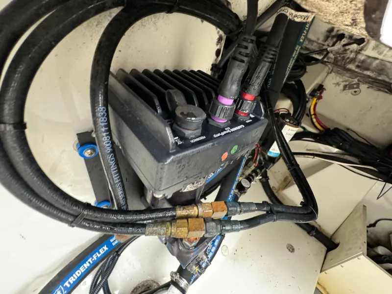 Slide: The Image of Engine compartment of a 2010 Hydra-Sports 3500 VX with visible wiring and components. - 37