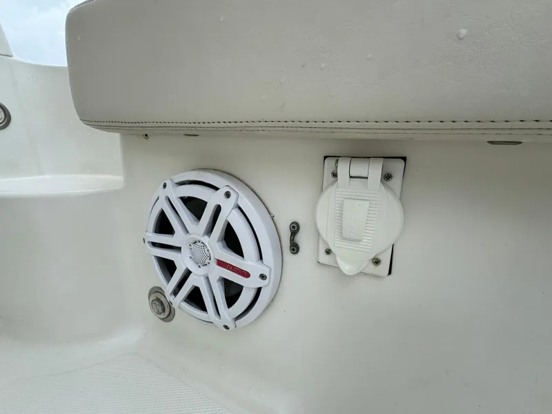 Slide: The Image of Hydra-Sports 3500 VX 2010 boat speaker and outlet on white interior panel. - 38