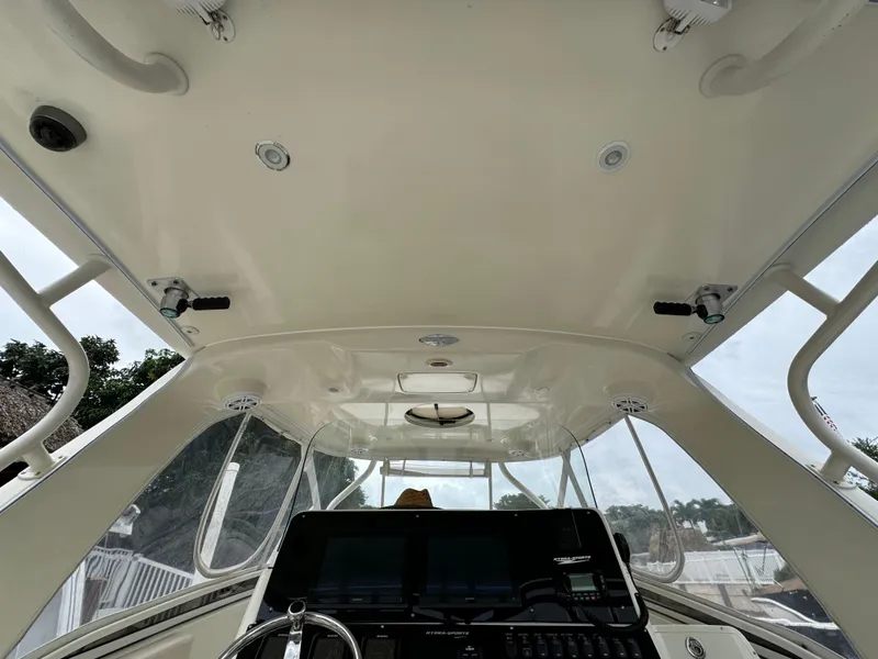 Slide: The Image of 2010 Hydra-Sports 3500 VX boat cockpit with steering wheel and control panel. - 46