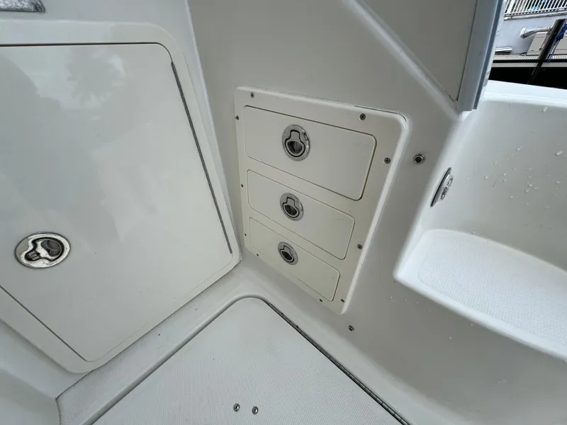 Slide: The Image of 2010 Hydra-Sports 3500 VX boat interior storage compartments and seating area. - 49