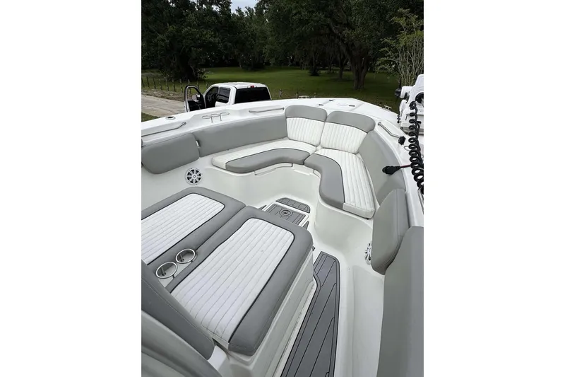 Slide: The Image of 2017 Sea Fox 266 Commander boat interior with cushioned seating and cup holders. - 1
