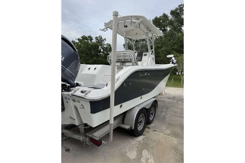 Slide: The Image of 2017 Sea Fox 266 Commander boat on trailer, featuring sleek design and dual engines. - 10