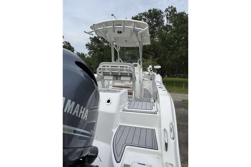 Slide: The Image of 2017 Sea Fox 266 Commander boat with Yamaha engine, docked outdoors. - 16
