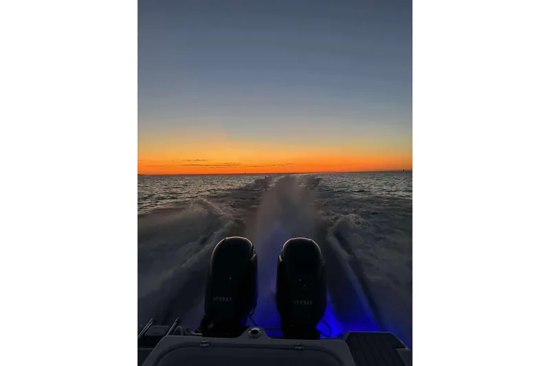 Slide: The Image of Sea Fox 266 Commander boat cruising at sunset, 2017 model, with illuminated engines. - 19