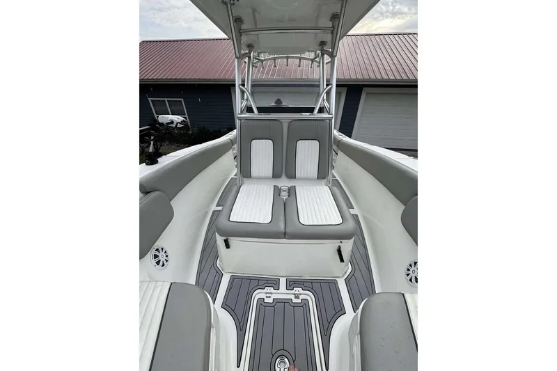 Slide: The Image of 2017 Sea Fox 266 Commander boat interior with gray and white seating and flooring. - 2