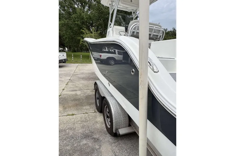 Slide: The Image of 2017 Sea Fox 266 Commander boat on trailer, parked outdoors. - 21