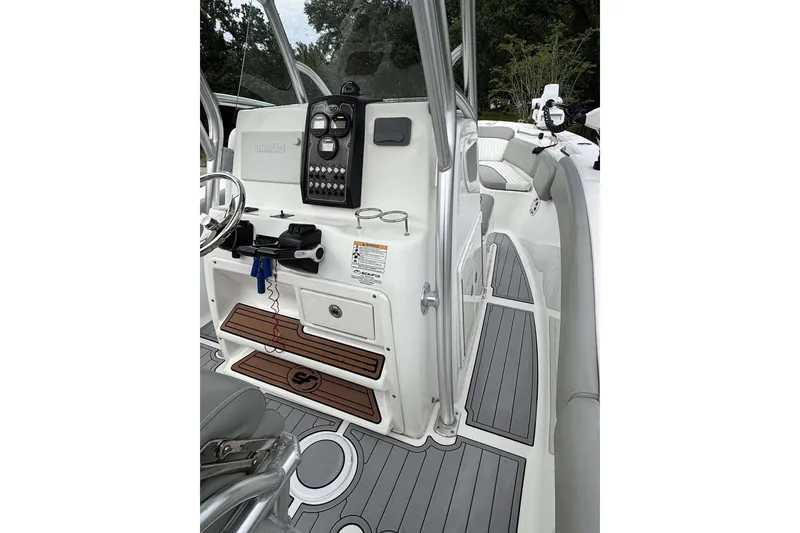 Slide: The Image of 2017 Sea Fox 266 Commander boat interior with helm, controls, and seating area. - 24