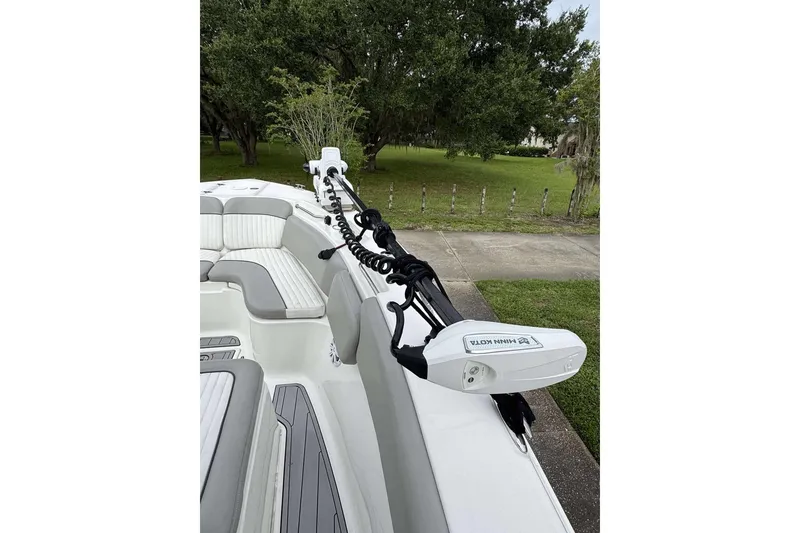 Slide: The Image of 2017 Sea Fox 266 Commander boat with Minn Kota trolling motor, parked on a driveway. - 4
