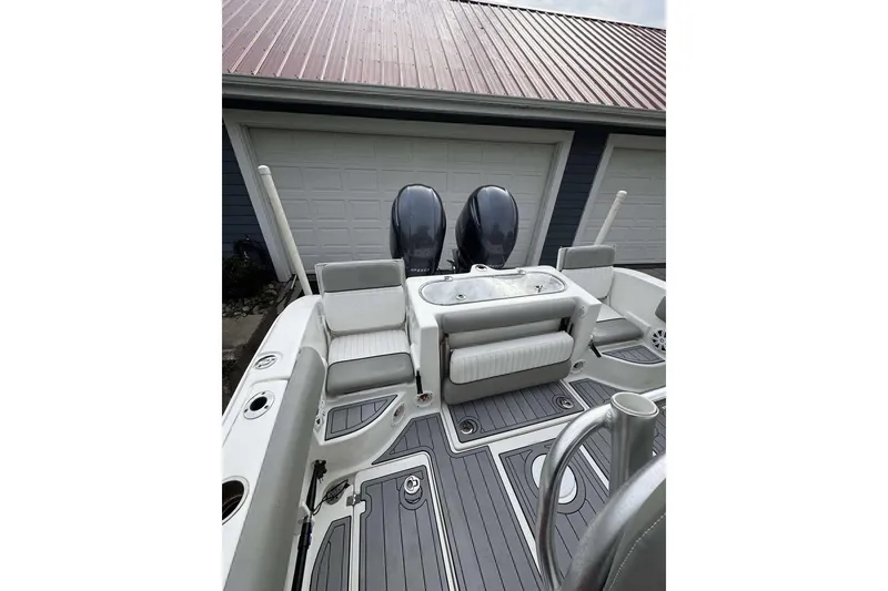 Slide: The Image of 2017 Sea Fox 266 Commander boat interior with seating and dual engines. - 7