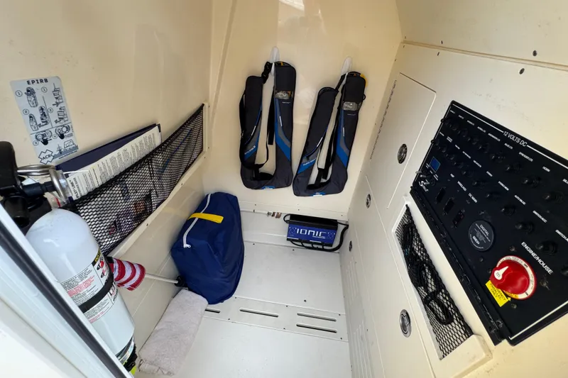 Slide: The Image of 2020 Scout 235 XSF boat interior with safety gear and control panel. - 16