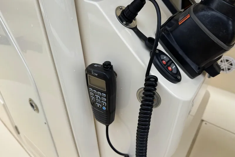 Slide: The Image of 2020 Scout 235 XSF boat console with Icom radio and control panel. - 18