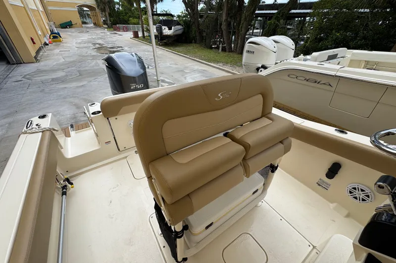 Slide: The Image of 2020 Scout 235 XSF boat interior with Yamaha 250 engine, docked near Cobia boat. - 20