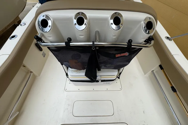 Slide: The Image of 2020 Scout 235 XSF boat interior with rod holders and storage net. - 26