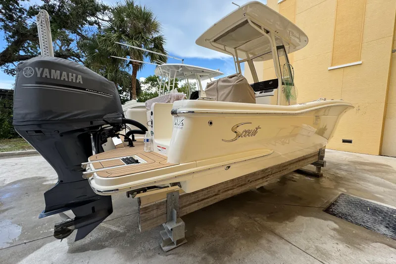 Slide: The Image of 2020 Scout 235 XSF boat with Yamaha engine, parked outdoors on a stand. - 3