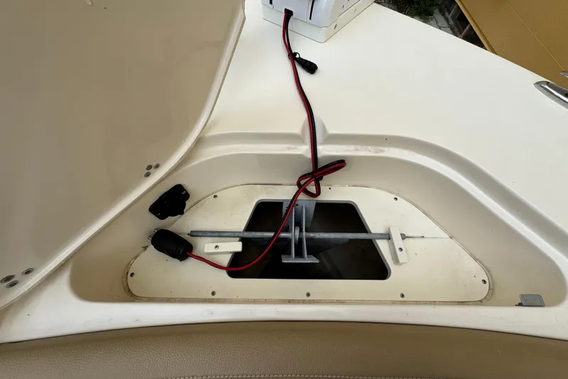 Slide: The Image of 2020 Scout 235 XSF boat anchor compartment with wiring and storage space. - 5