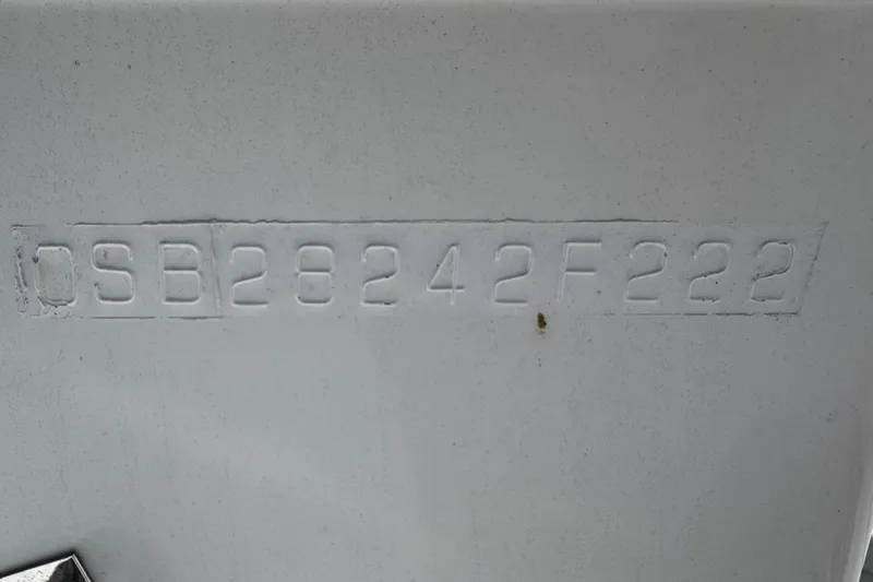 Slide: The Image of Hull identification number on a 2022 Whitewater 28 Open boat. - 11