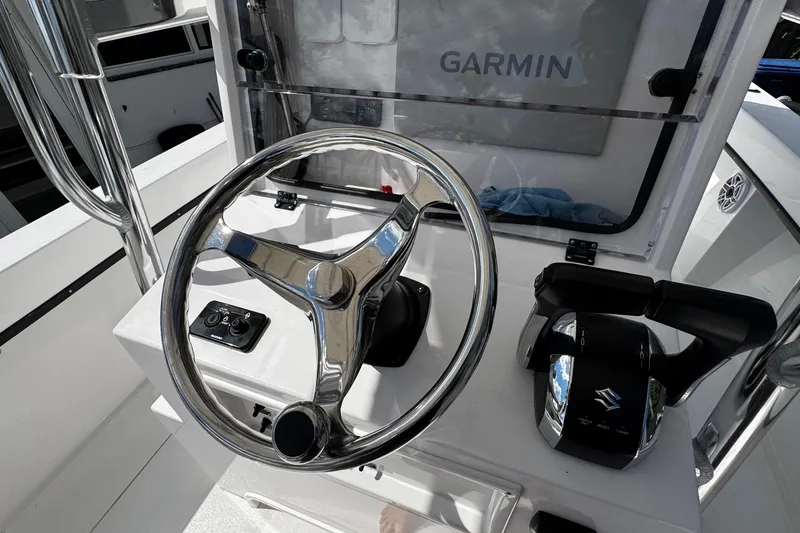 Slide: The Image of Steering console of 2022 Whitewater 28 Open boat with Garmin navigation system. - 20