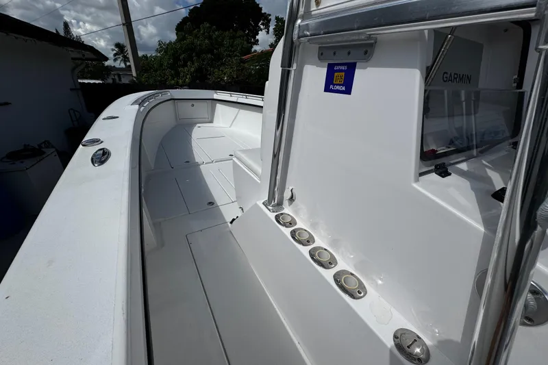 Slide: The Image of 2022 Whitewater 28 Open boat interior with Garmin equipment, docked in Florida. - 23