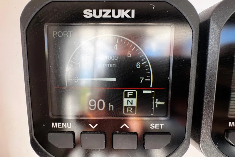 Slide: The Image of Suzuki engine display showing 90 hours on a 2022 Whitewater 28 Open boat. - 30
