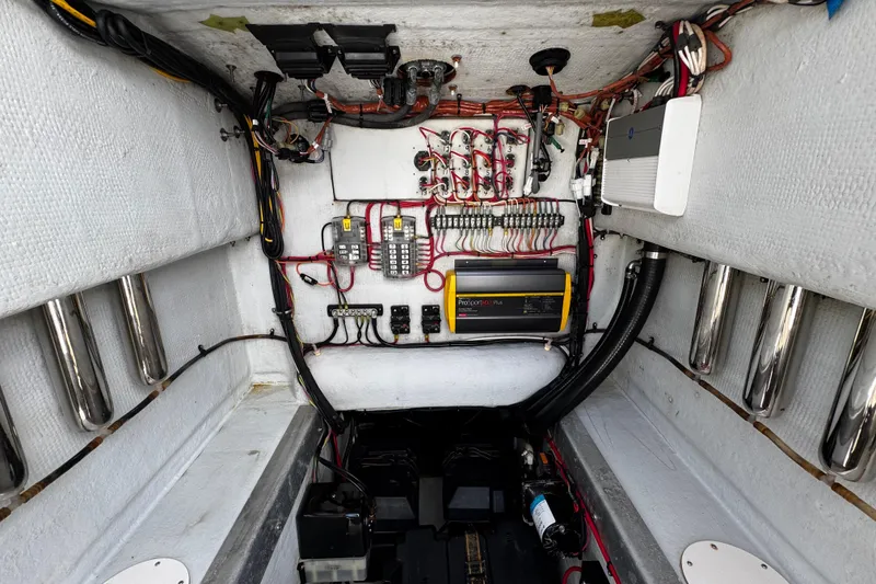 Slide: The Image of Electrical system inside a 2022 Whitewater 28 Open boat, showcasing wiring and components. - 32