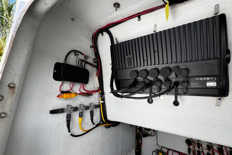 Slide: The Image of Electrical panel inside 2022 Whitewater 28 Open boat, featuring wiring and connections. - 34