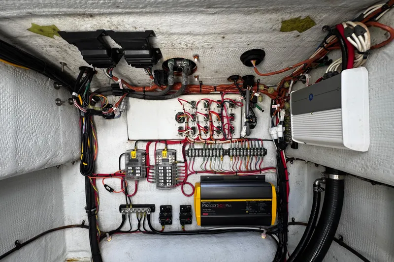 Slide: The Image of Electrical system inside a 2022 Whitewater 28 Open boat, featuring wiring and components. - 36