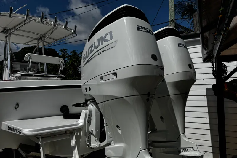 Slide: The Image of Twin Suzuki 250 outboard engines on a 2022 Whitewater 28 Open boat. - 5