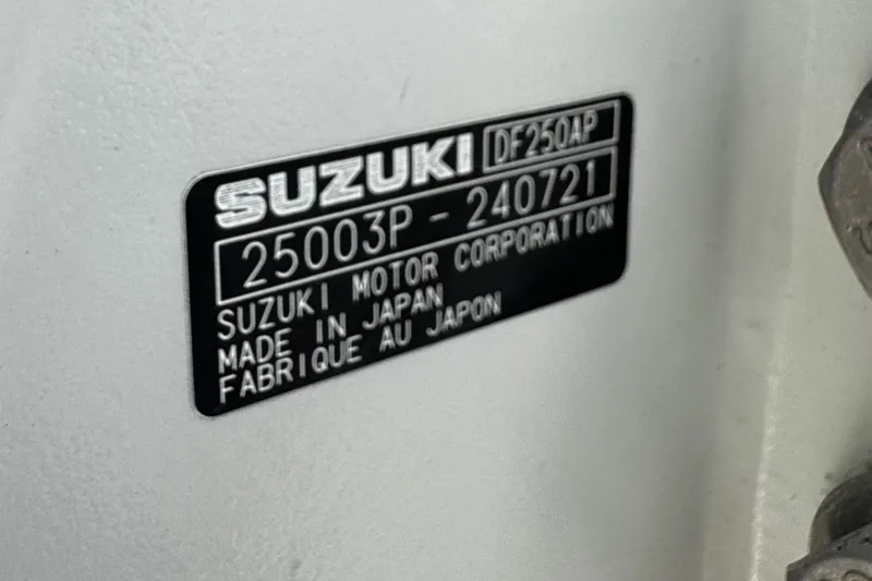 Slide: The Image of Suzuki motor label on 2022 Whitewater 28 Open, made in Japan. - 9