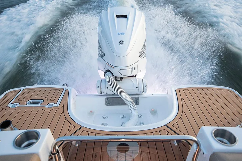 Slide: The Image of Manufacturer Provided Image: 2020 Hurricane SunDeck 191 OB boat with powerful outboard motor on water. - 11